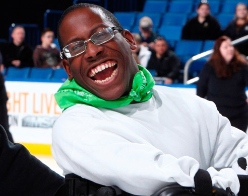 Photo of SABAH Athlete with a Volunteer ice skating. 